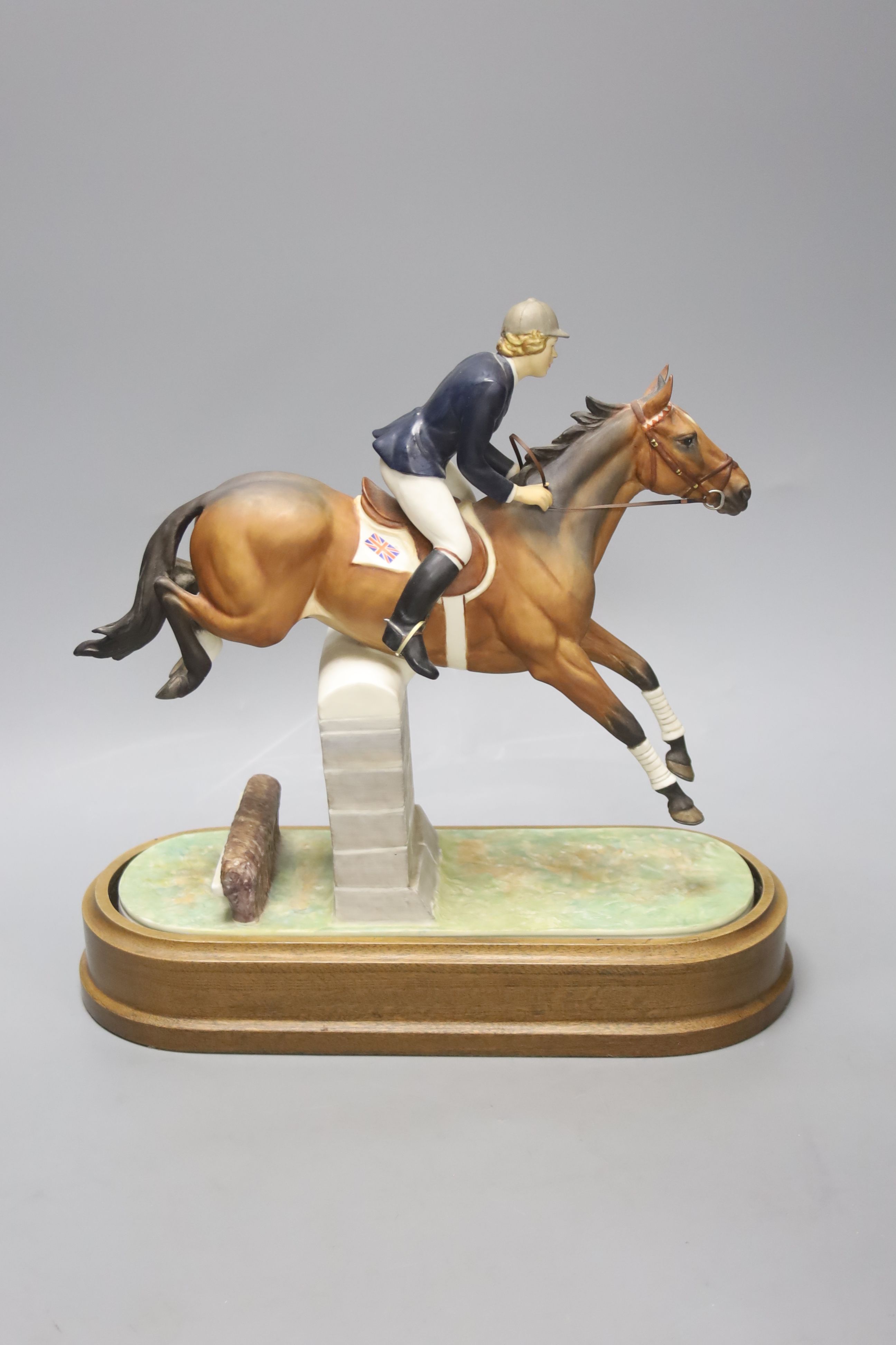 Doris Lindner for Royal Worcester, a limited edition figure, 'Marion Coakes on Stroller', no. 524/750, circa 1970, on wooden plinth, with certificate